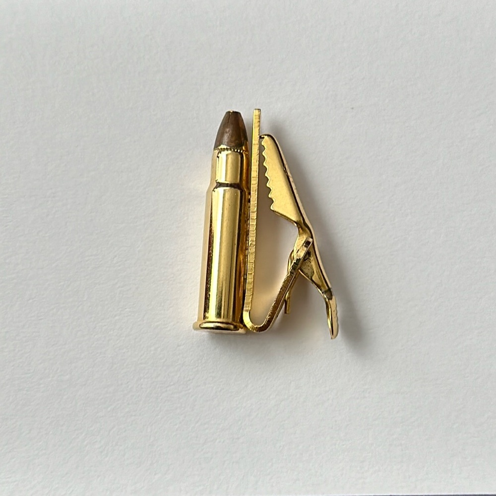 Gold plated .22 Caliber bullet tie clip.